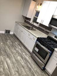 Home Decorators Stony Oak Grey Vinyl Plank Flooring White Shaker Kitchen Cabinets Grey Vinyl Plank Flooring Vinyl Plank Flooring Vinyl Flooring Kitchen