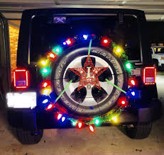Christmas Lights Attached To Spare Tire On Jeep Wrangler Safari Unlimited Attached Appropriatel Jeep Wrangler Lights Christmas Float Ideas Jeep Wrangler Tires