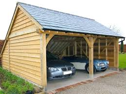 A very substantial and convenient carport. Timber Frame Carport Oak Frame Carports Oak Framed Carports Timber Car Port Kits Carports Carports Timber Frame Garages Timber Frame Carport Price