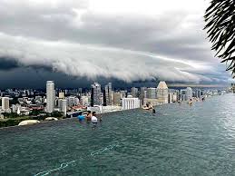 From an indoor perspective, you can hear the rain fall on the metal roof and spatter onto the ground. Moment Before Downpour In Singapore Today Massive Rain Clouds Hovering Above The City As Seen From Roof Top Pool Interestingasfuck