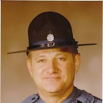 This is a portrait of Missouri Highway Patrolman, "Sgt. Earl Yates", as  seen from an article from the 1990 edition of the Blue Springs Examiner.  Blue Springs had some extra protection through