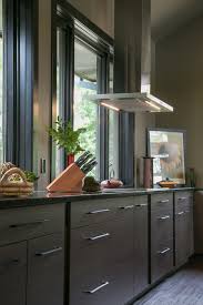 Cabinets above typically vary in height depending on the hood height and the height of adjacent wall cabinetry. Contemporary Kitchen Cabinets Plato Woodwork Dark Finish Stainless Steel Range Hood Jpg Geneva Cabinet Company Llc
