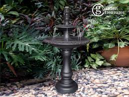 These colorful planters have bubbling fountains rising from the narrow mouths, without any water ever dribbling down the sides. Garden Treasures 34 6 In H Metal Tiered Outdoor Fountain Lowes Com Water Fountains Outdoor Outdoor Fountain Fountain