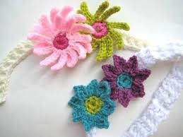 Earwarmer that can be worn as neckwarmer with knit leaf embellishments. Baby Headband With Flowers Free Crochet Pattern Crochet Dreamz