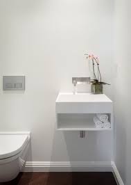 Small Toilets Find Tankless And Wall Mounted Toilet Designs Online Small Bathroom Vanities Small Bathroom Sinks Powder Room Sink