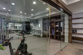But, did you know that it may not be healthy for you to exercise and workout in an basement exercise room? Basement Gym Workout With Glass Walls Transitional Home Gym Denver By Fbc Remodel