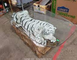 White tiger coffee table coffee table a coffee table, also called a cocktail table, is a style of long, low table which is designed to be placed in front of a sofa, to support beverages (hence the. Sound Auction Service Auction 04 01 21 Hartman Ramey Others Online Auction Item Unique White Tiger W Cub Glass Top Coffee Table
