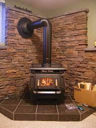 Maybe you would like to learn more about one of these? Photo Of Wall Behind Wood Burning Stove From A Kodiak Mountain Stone Review Wood Burning Stove Corner Wood Stove Fireplace Wood Stove