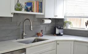 Stacked stone backsplash and stainless steel range hood. Natural Stacked Stone Backsplash Tiles For Kitchens And Bathrooms