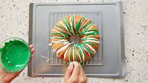 Add some red food coloring to one of the smaller bowls of batter and mix well. How To Make A Christmas Wreath Bundt Cake Bettycrocker Com