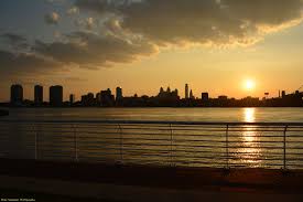 sunset across the delaware river from the camden waterfront