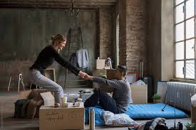 Sounds like a bit too much, i know, but it's true. Happy Couple Having Fun In New House By Garage Island Crew Happy Joy Stocksy United