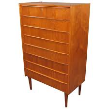 Yes, the main difference is that a dresser with deep drawers usually includes an attached mirror on top, whereas a chest also comes with drawers but has an empty surface. Danish Modern Mid Century Teak Dresser With Drawer Lock Key For Sale At 1stdibs