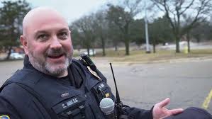 10-year-old battling brain cancer swears in as Lansing police officer