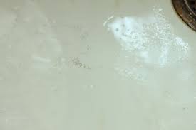 remove scratches from a cast iron sink