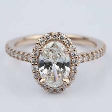 The design serves to make the center stone look larger while maximizing its brilliance. Oval Halo Diamond Engagement Ring In Rose Gold 1 50 Ct