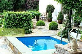 A swimming pool, swimming bath, wading pool, paddling pool, or simply pool is a structure designed to hold water to enable swimming or other leisure activities. Small Swimming Pool Stock Photo By Elke Borkowski Image 0091925