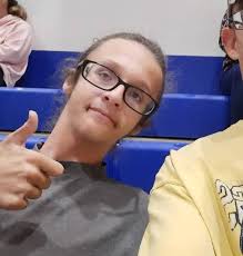 What is happening at the gathering near Hwy 86 across from Travertine Rock?