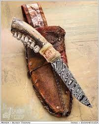 Tribute Frontier Hunter! Buddy Thomas is @ForgedInSilence, and he had me  capture this three weeks ago in Bellville. His steel, deer jaw handle,  copper and elk hide sheath. His notes