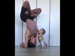 Yoga moms and kids videos. Baby Climbs On Mom Performing Yoga Pose 985013 Youtube