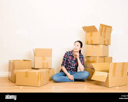 Image of person surrounded by countless moving boxes