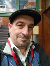 Meet the director/producer! He's wearing a hat to cover the fact that he  pulls his hair out