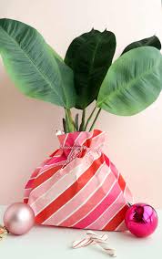 So to save money, just buy a few extra rolls of paper and make a few bags to have on hand for those last minute gifts. How To Make A Gift Bag Out Of Wrapping Paper A Beautiful Mess
