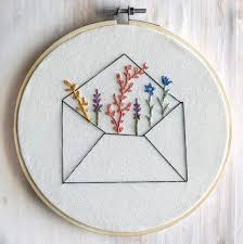 Embroidered Wildflowers Bursting From An Unassuming Envelope A Sweet Reminder Of How Embroidery Hoop Wall Embroidery Flowers Pattern Embroidery Hoop Wall Art