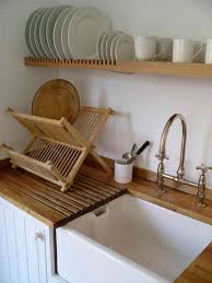 Floating kitchen shelves are a popular alternative when you choose to use your upper enclosed cabinets. Image Detail For Beech Floating Shelf Becomes A Plate Rack Over The Draining Board Plate Racks Farmhouse Inspired Kitchen Wall Mounted Plate Rack