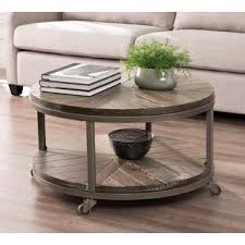 Black metal adds a farmhouse charm with two large rollers on the sides and two steering small rollers on each end. Casters Rustic Coffee Tables You Ll Love In 2021 Wayfair