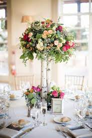 Tall Rustic Wooden Centerpiece With Pink Flowers And Greenery Colorful Tall Wedding Centerpieces Rustic Tall Wedding Centerpieces Rustic Wedding Centerpieces