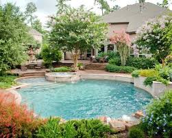 Example Of A Large Classic Backyard Round Pool Design In Houston With Brick Pavers Desert Landscape Landscaping Around Pool Backyard Pool Swimming Pool Designs