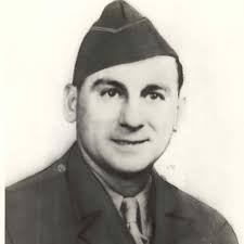 Gunner Kenneth Bratton, wounded in the knee by shrapnel, being pulled out  of the turret of a TBF Avenger aircraft aboard USS Saratoga after a  successful raid