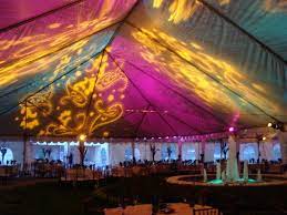 Tent Lighting With Monogram Gobos And Flood Washes Of Pink And Green Tent Lighting Wedding Lights Wedding Tent Lighting