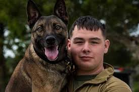 Cpl. Jason E. Casbeer and his military working dog,