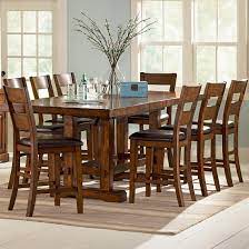 This specific counter height high chair is great for parents looking for something to fit a bar height table! Steve Silver Zappa 9 Piece Counter Height Table Chair Set Wayside Furniture Pub Table And Stool Sets
