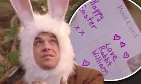 Robbie Williams dresses as Easter bunny in throwback music video