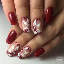 Diseños de uñas realizados sobre un fondo de esmalte negro, realizaremos encima los dibujos de decorados de uñas, con la ayuda de pinceles finos y esmaltes blancos e rojos, decoracion de uñas paso a paso. Decoracion De Unas Rojas Con Flores Blancas Unas Decoradas