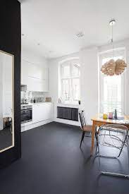 Concrete floor wooden cupboards coco lapine. Black Painted Concrete Floor For A White Kitchen Apartment Design Home Minimal Apartment