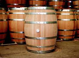 Barrel definition, a cylindrical wooden container with slightly bulging sides made of staves hooped together, and with flat, parallel ends. Barrel Wikipedia