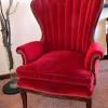 This petite accent chair is beautifully hand carved from 100% solid mango wood and upholstered in a beautiful wine red cotton velvet. 1