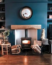 32 Cozy Blue Living Room Design Ideas In 2020 Feature Wall Living Room Log Burner Living Room Cosy Living Room