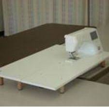 How To Make Your Own Machine Quilting Table Hunker Machine Quilting Sewing Machine Extension Tables Sewing Rooms