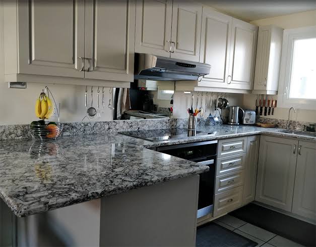 Sleek Two-Tone Painted Kitchen Cabinets After Refinishing