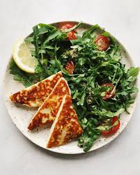 Pan Fried Halloumi Cheese A Huge Side Of Arugula Salad With Caper Lemon Dressing Beef Recipes Easy Arugula Salad Popular Healthy Recipes