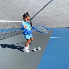 The tennis racket looks iffy. Kylie Jenner S 2 Year Old Daughter Stormi Plays Tennis With 475 Chanel Balls