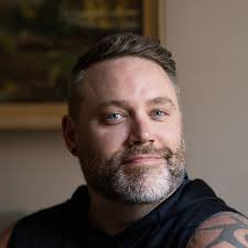 Photographing hummingbirds in a garden with red currant shrubs