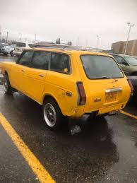 Image result for Herald Yellow 1976 Subaru