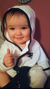 daughter giving thumbs up to patriots