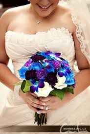 This beautiful orchid is perfect for bringing a luxurious tropical feel to your wedding designs and giving them dramatic color and height that will turn heads! 404 Not Found Purple Bridal Bouquet Blue Orchid Bouquet Blue Purple Wedding